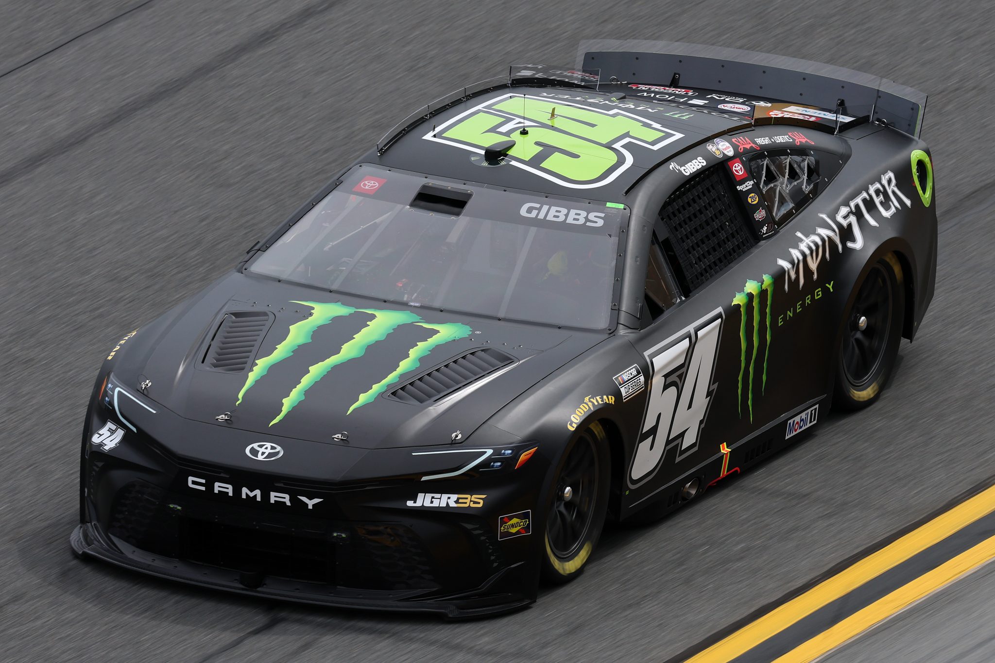 DAYTONA BEACH, FLORIDA - FEBRUARY 11: Ty Gibbs, driver of the #54 Monster Energy Toyota, drives during practice for the NASCAR Cup Series Daytona 500 at Daytona International Speedway on February 11, 2026 in Daytona Beach, Florida. (Photo by Chris Graythen/Getty Images) | Getty Images
