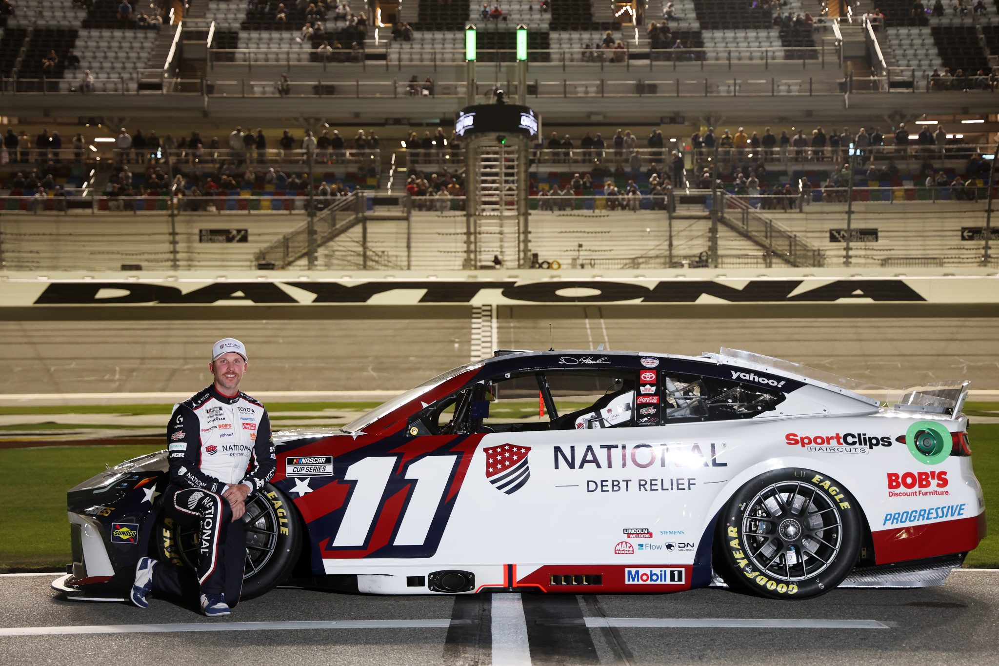 DAYTONA BEACH, FLORIDA - FEBRUARY 11: Denny Hamlin, driver of the #11 National Debt Relief Toyota, poses for a photo during qualifying for the NASCAR Cup Series Daytona 500 at Daytona International Speedway on February 11, 2026 in Daytona Beach, Florida. (Photo by Chris Graythen/Getty Images) | Getty Images