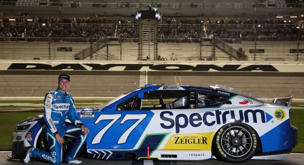 DAYTONA BEACH, FLORIDA - FEBRUARY 11: Carson Hocevar, driver of the #77 Spectrum Chevrolet, poses for a photo during qualifying for the NASCAR Cup Series Daytona 500 at Daytona International Speedway on February 11, 2026 in Daytona Beach, Florida. (Photo by Chris Graythen/Getty Images) | Getty Images
