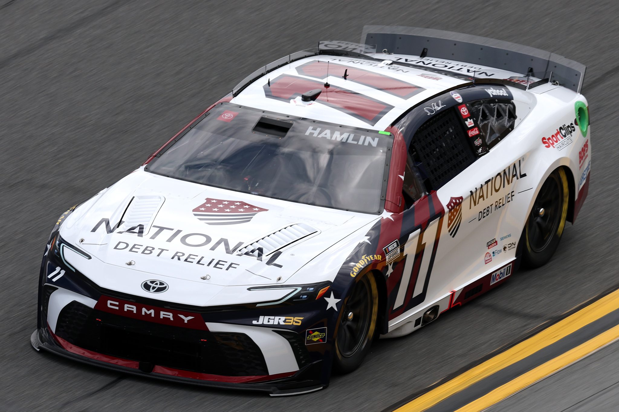 DAYTONA BEACH, FLORIDA - FEBRUARY 11: Denny Hamlin, driver of the #11 National Debt Relief Toyota, drives during practice for the NASCAR Cup Series Daytona 500 at Daytona International Speedway on February 11, 2026 in Daytona Beach, Florida. (Photo by Chris Graythen/Getty Images) | Getty Images
