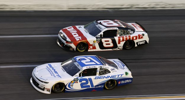 HAMPTON, GEORGIA - FEBRUARY 21: Austin Hill, driver of the #21 Bennett Transportation Chevrolet, and Sammy Smith, driver of the #8 Pilot Chevrolet, race during the NASCAR O'Reilly Auto Parts Series Bennett Transportation & Logistics 250 at Echo Park Speedway on February 21, 2026 in Hampton, Georgia. (Photo by Sean Gardner/Getty Images) | Getty Images