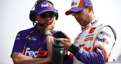 ELKHART LAKE, WISCONSIN - JULY 04: Denny Hamlin, driver of the #11 FedEx Freight Toyota, and crew chief Christopher Gabehart talk on the grid during qualifying for the NASCAR Cup Series Jockey Made in America 250 Presented by Kwik Trip at Road America on July 04, 2021 in Elkhart Lake, Wisconsin. (Photo by Jared C. Tilton/Getty Images) | Getty Images