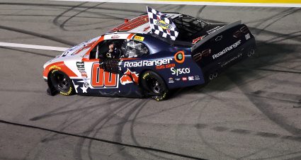 HAMPTON, GEORGIA - FEBRUARY 21: Sheldon Creed, driver of the #00 Road Ranger Chevrolet, drives with the checkered flag after winning the NASCAR O'Reilly Auto Parts Series Bennett Transportation & Logistics 250 at Echo Park Speedway on February 21, 2026 in Hampton, Georgia. (Photo by Jonathan Bachman/Getty Images) | Getty Images