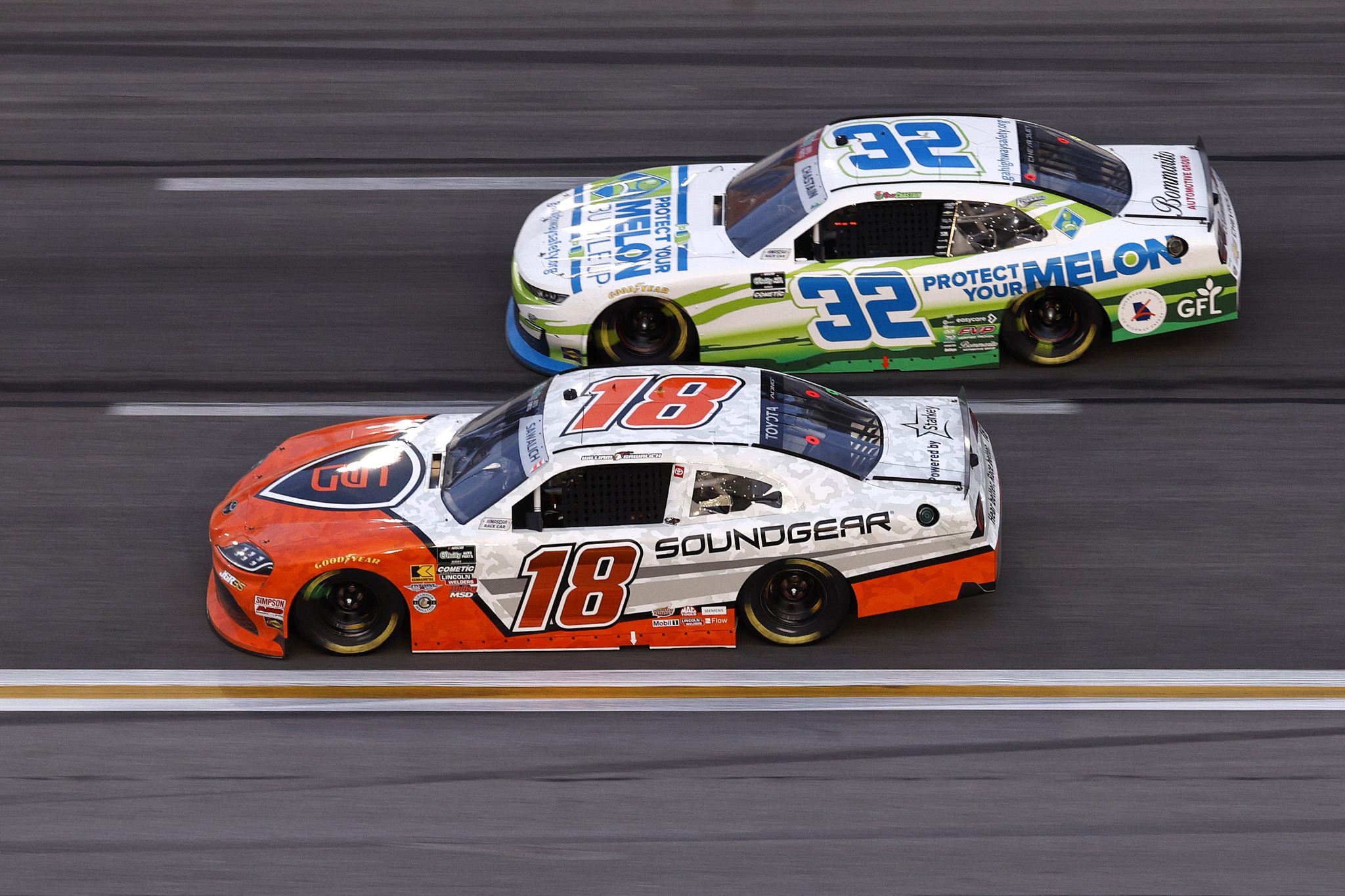 HAMPTON, GEORGIA - FEBRUARY 21: William Sawalich, driver of the #18 Soundgear Toyota, and Ross Chastain, driver of the #32 Protect Your Melon Chevrolet, race during the NASCAR O'Reilly Auto Parts Series Bennett Transportation & Logistics 250 at Echo Park Speedway on February 21, 2026 in Hampton, Georgia. (Photo by Sean Gardner/Getty Images) | Getty Images