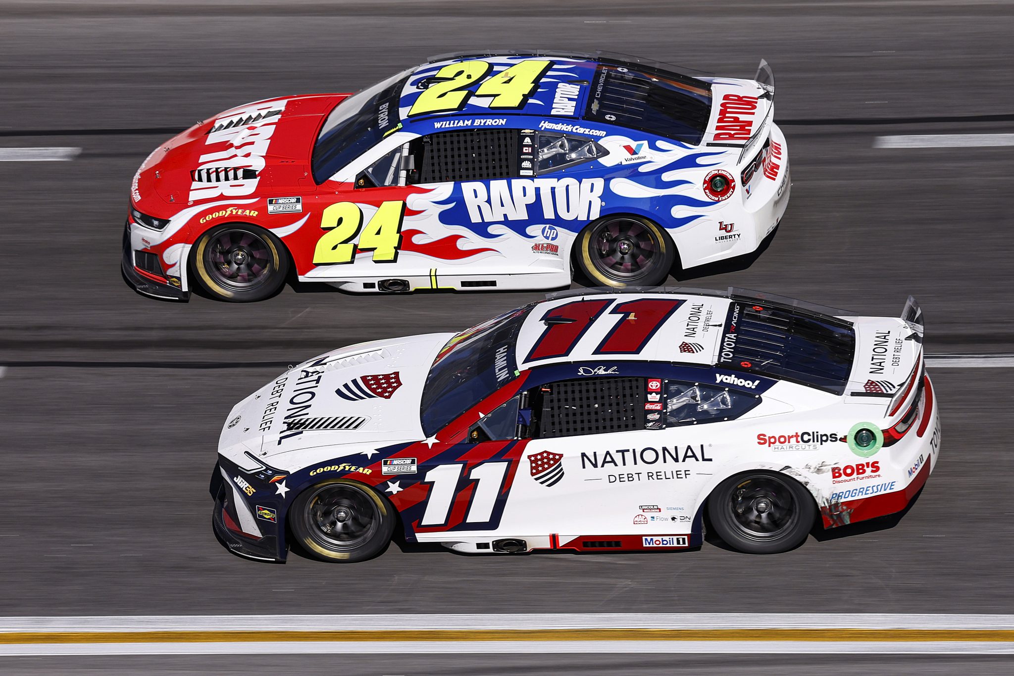 HAMPTON, GEORGIA - FEBRUARY 22: Denny Hamlin, driver of the #11 National Debt Relief Toyota, and William Byron, driver of the #24 Raptor Chevrolet, race during the NASCAR Cup Series Autotrader 400 at Echo Park Speedway on February 22, 2026 in Hampton, Georgia. (Photo by Sean Gardner/Getty Images) | Getty Images