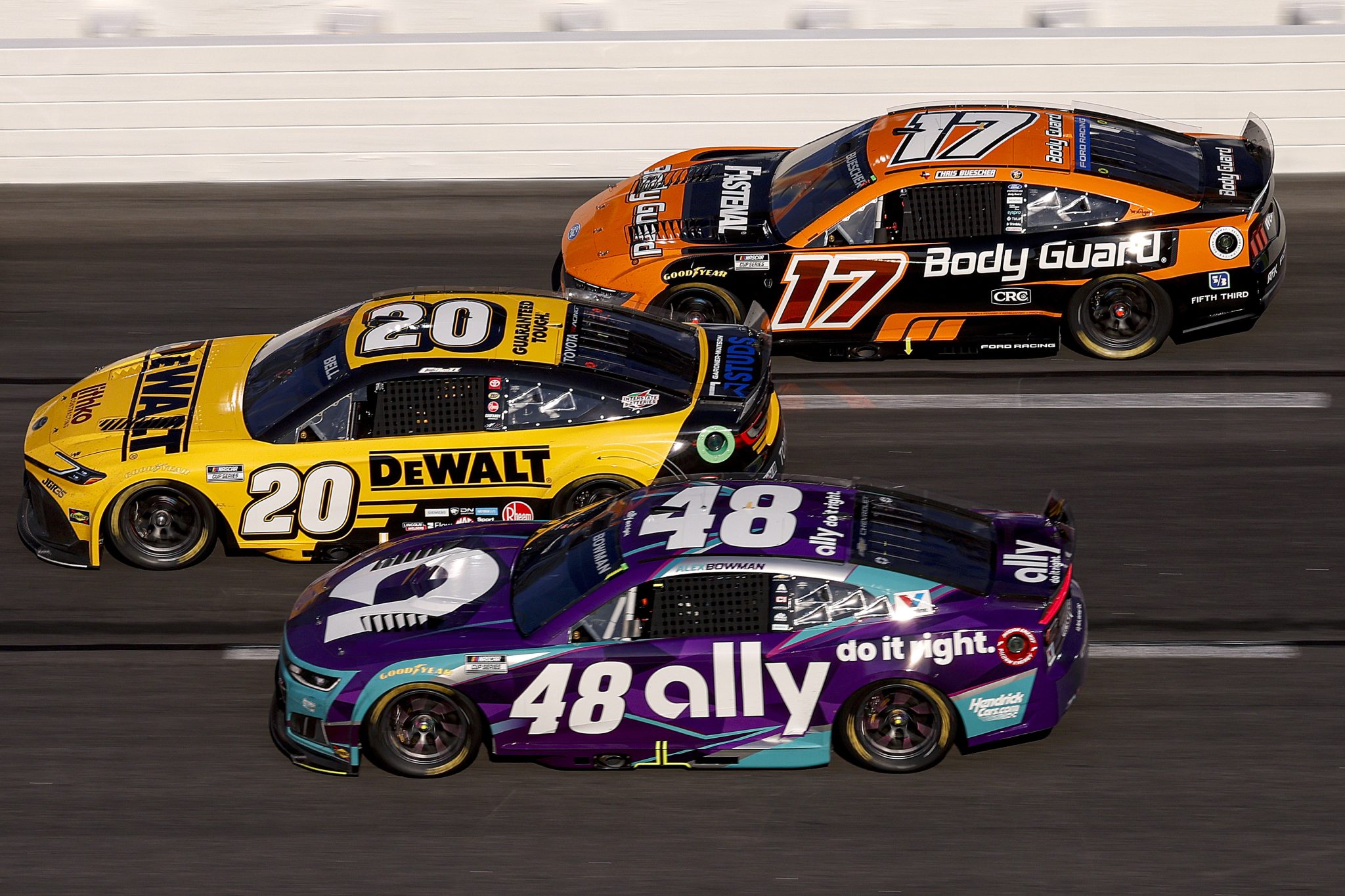 HAMPTON, GEORGIA - FEBRUARY 22: Alex Bowman, driver of the #48 Ally Chevrolet, Christopher Bell, driver of the #20 DEWALT Toyota, and Chris Buescher, driver of the #17 Body Guard Ford, race during the NASCAR Cup Series Autotrader 400 at Echo Park Speedway on February 22, 2026 in Hampton, Georgia. (Photo by Sean Gardner/Getty Images) | Getty Images