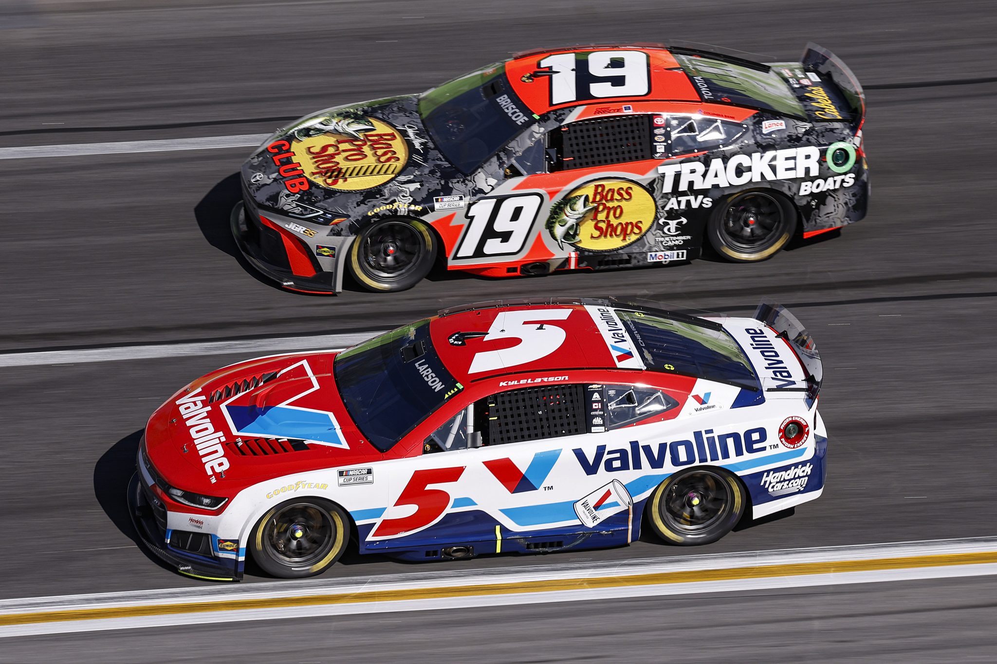 HAMPTON, GEORGIA - FEBRUARY 22: Kyle Larson, driver of the #5 Valvoline Chevrolet, and Chase Briscoe, driver of the #19 Bass Pro Shops Toyota, race during the NASCAR Cup Series Autotrader 400 at Echo Park Speedway on February 22, 2026 in Hampton, Georgia. (Photo by Sean Gardner/Getty Images) | Getty Images