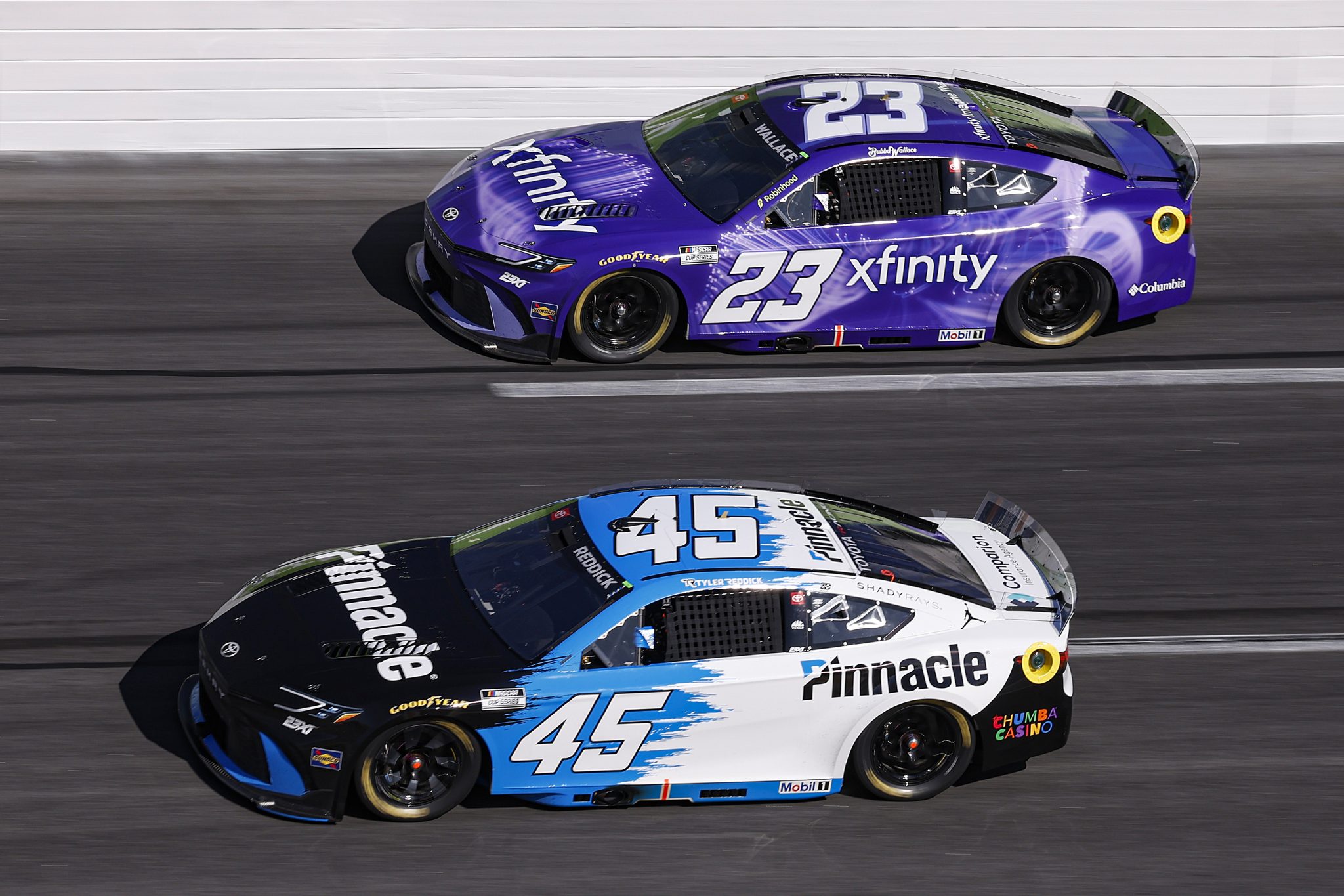 HAMPTON, GEORGIA - FEBRUARY 22: Tyler Reddick, driver of the #45 Pinnacle Toyota, and Bubba Wallace, driver of the #23 Xfinity Toyota, race during the NASCAR Cup Series Autotrader 400 at Echo Park Speedway on February 22, 2026 in Hampton, Georgia. (Photo by Sean Gardner/Getty Images) | Getty Images
