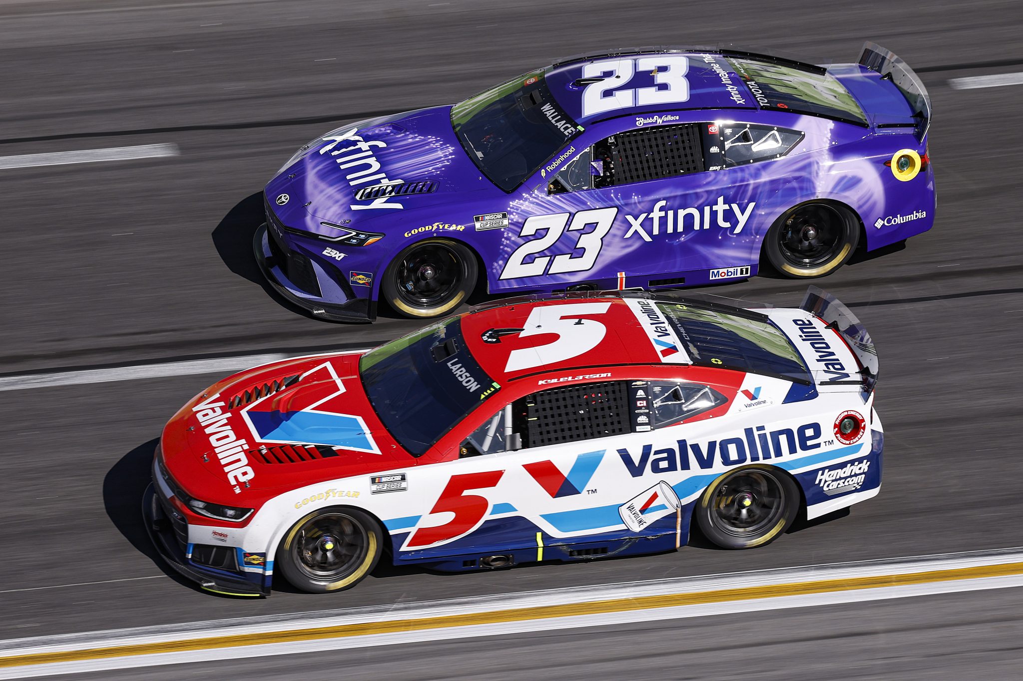 HAMPTON, GEORGIA - FEBRUARY 22: Kyle Larson, driver of the #5 Valvoline Chevrolet, and Bubba Wallace, driver of the #23 Xfinity Toyota, race during the NASCAR Cup Series Autotrader 400 at Echo Park Speedway on February 22, 2026 in Hampton, Georgia. (Photo by Sean Gardner/Getty Images) | Getty Images