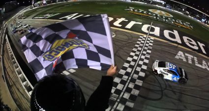 HAMPTON, GEORGIA - FEBRUARY 22: Tyler Reddick, driver of the #45 Pinnacle Toyota, takes the checkered flag to win the NASCAR Cup Series Autotrader 400 at Echo Park Speedway on February 22, 2026 in Hampton, Georgia. (Photo by Jonathan Bachman/Getty Images) | Getty Images