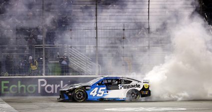 HAMPTON, GEORGIA - FEBRUARY 22: Tyler Reddick, driver of the #45 Pinnacle Toyota, celebrates with a burnout after winning the NASCAR Cup Series Autotrader 400 at Echo Park Speedway on February 22, 2026 in Hampton, Georgia. (Photo by Sean Gardner/Getty Images) | Getty Images