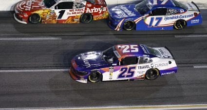 HAMPTON, GEORGIA - FEBRUARY 21: Carson Kvapil, driver of the #1 Arby's Chevrolet, Corey Day, driver of the #17 HendrickCars.com Chevrolet, and Nick Sanchez, driver of the #25 Paynuity/Travel Curious Ford, race during the NASCAR O'Reilly Auto Parts Series Bennett Transportation & Logistics 250 at Echo Park Speedway on February 21, 2026 in Hampton, Georgia. (Photo by Sean Gardner/Getty Images) | Getty Images