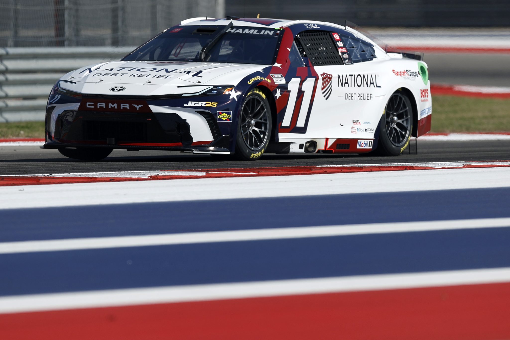 AUSTIN, TEXAS - FEBRUARY 28: Denny Hamlin, driver of the #11 National Debt Relief Toyota, drives during qualifying for the NASCAR Cup Series DuraMax Grand Prix Powered by RelaDyne at Circuit of The Americas on February 28, 2026 in Austin, Texas. (Photo by Logan Riely/Getty Images) | Getty Images