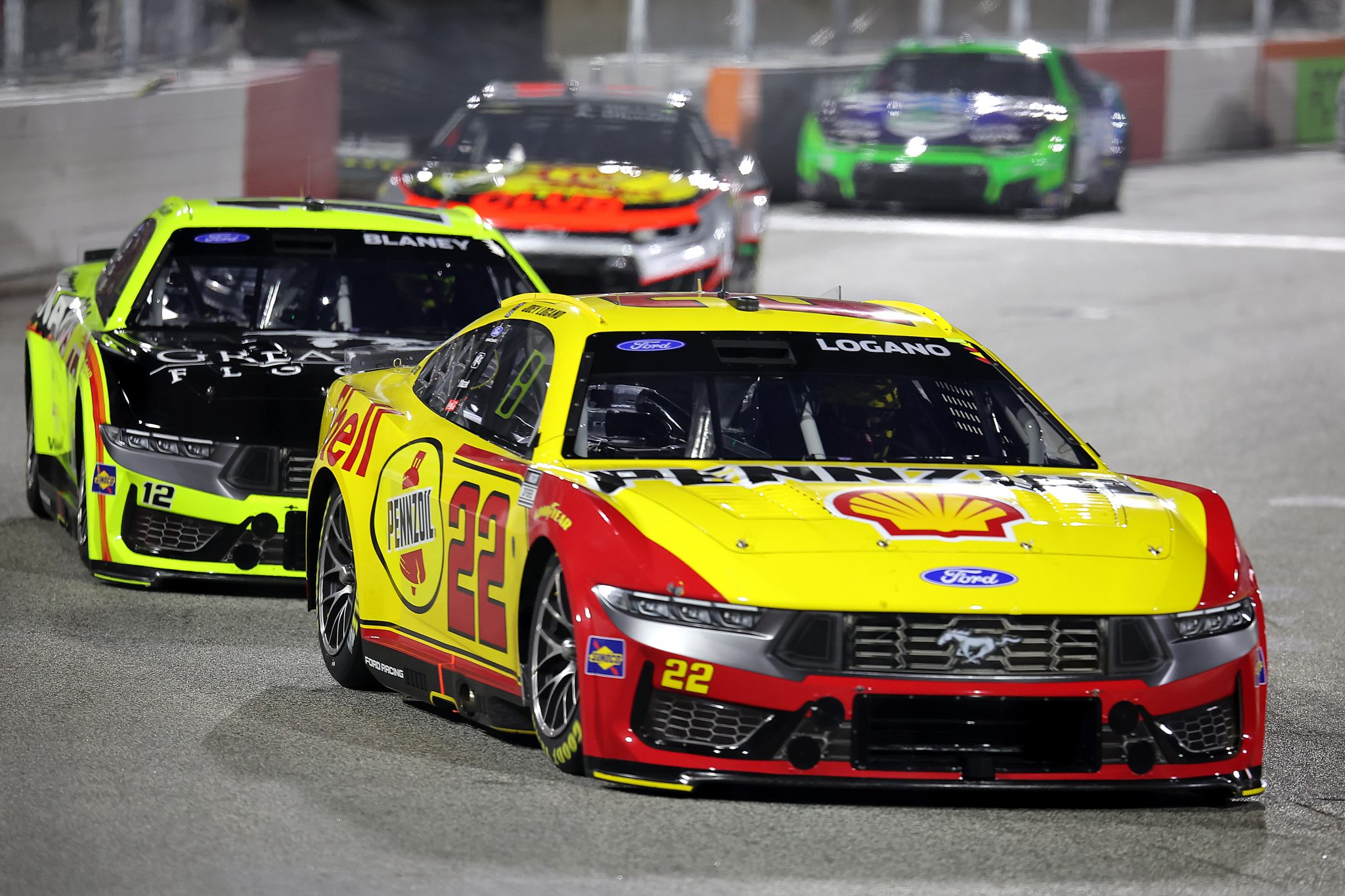 WINSTON SALEM, NORTH CAROLINA - FEBRUARY 04: Joey Logano, driver of the #22 Shell Pennzoil Ford, and Ryan Blaney, driver of the #12 Menards/Great Lakes Flooring Ford, race during the Cook Out Clash at Bowman Gray Stadium at Bowman Gray Stadium on February 04, 2026 in Winston Salem, North Carolina. (Photo by Jonathan Bachman/Getty Images) | Getty Images