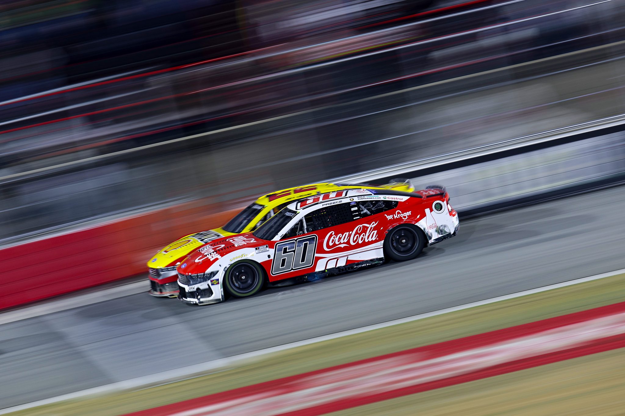 WINSTON SALEM, NORTH CAROLINA - FEBRUARY 04: Ryan Preece, driver of the #60 Kroger/Coca-Cola Ford, and Joey Logano, driver of the #22 Shell Pennzoil Ford, race during the Cook Out Clash at Bowman Gray Stadium at Bowman Gray Stadium on February 04, 2026 in Winston Salem, North Carolina. (Photo by Jonathan Bachman/Getty Images) | Getty Images