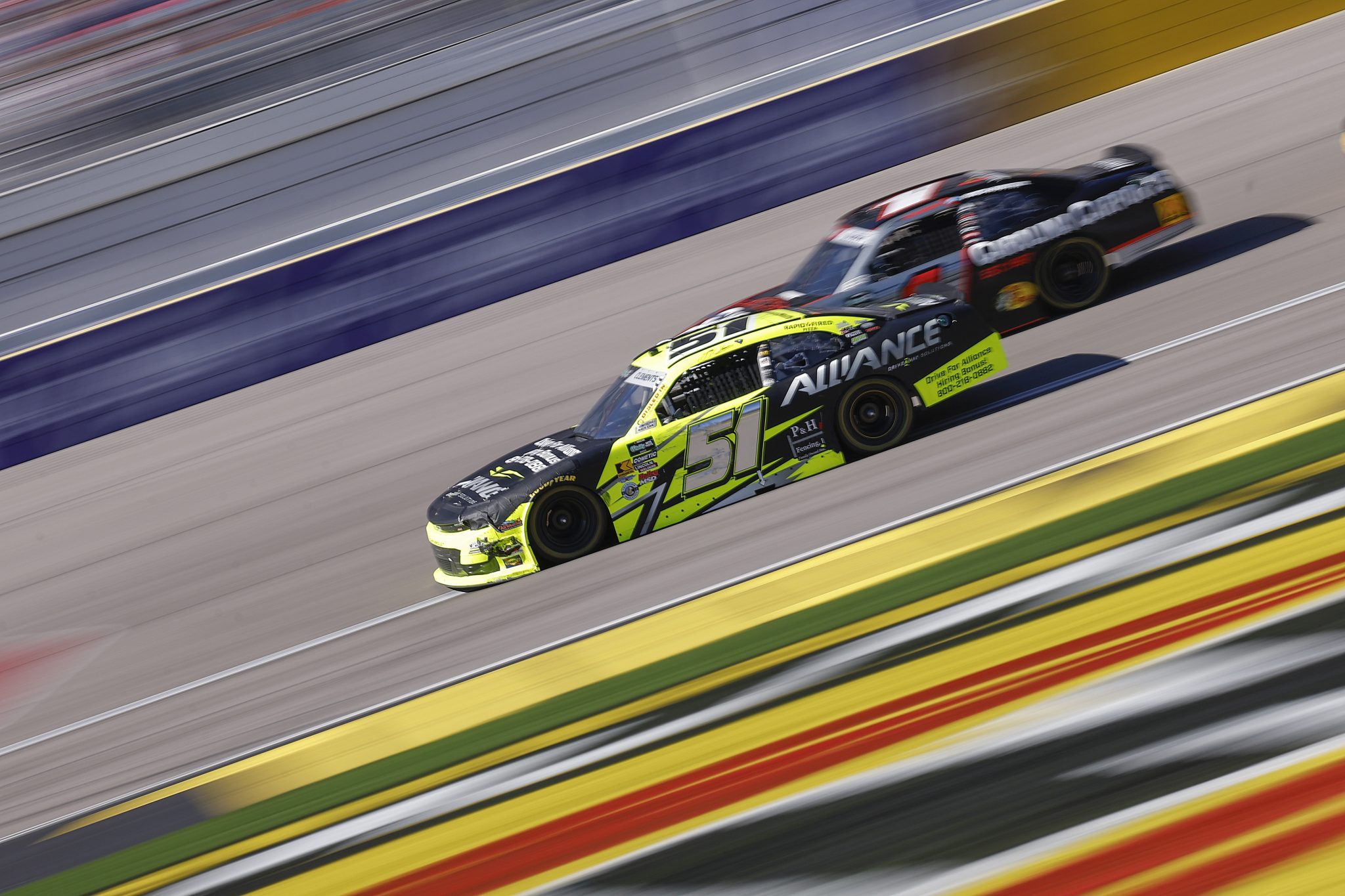 LAS VEGAS, NEVADA - MARCH 14: Jeremy Clements, driver of the #51 Alliance Driveway Solutions Chevrolet, and Connor Zilisch, driver of the #1 Carolina Carports Chevrolet, race during the NASCAR O'Reilly Auto Parts Series The LiUNA! at Las Vegas Motor Speedway on March 14, 2026 in Las Vegas, Nevada. (Photo by Sean Gardner/Getty Images) | Getty Images