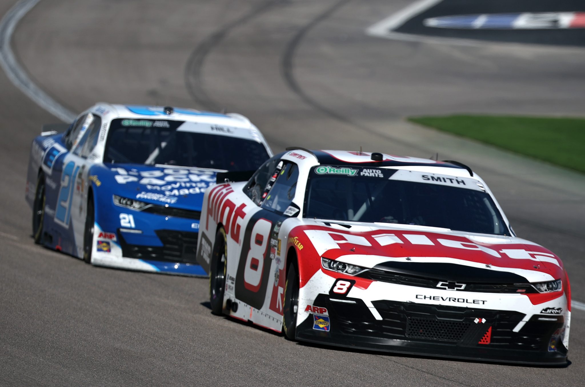LAS VEGAS, NEVADA - MARCH 14: Sammy Smith, driver of the #8 Pilot Chevrolet, and Austin Hill, driver of the #21 1-800-PACK-RAT Chevrolet, race during the NASCAR O'Reilly Auto Parts Series The LiUNA! at Las Vegas Motor Speedway on March 14, 2026 in Las Vegas, Nevada. (Photo by Chris Graythen/Getty Images) | Getty Images
