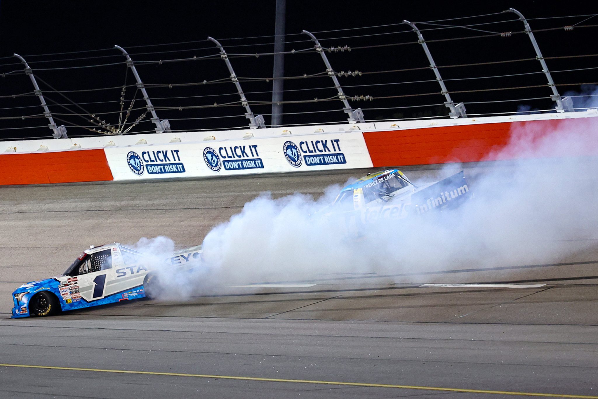 DARLINGTON, SOUTH CAROLINA - MARCH 20: William Sawalich, driver of the #1 Starkey Toyota, and Andres Perez De Lara, driver of the #44 Telcel Chevrolet, spin after an on-track incident during the NASCAR Craftsman Truck Series Buckle Up South Carolina 200 at Darlington Raceway on March 20, 2026 in Darlington, South Carolina. (Photo by David Jensen/Getty Images) | Getty Images