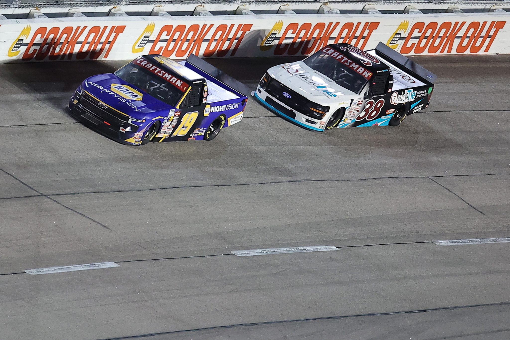 DARLINGTON, SOUTH CAROLINA - MARCH 20: Daniel Hemric, driver of the #19 NAPA Nightvision Chevrolet, and Chandler Smith, driver of the #38 QuickTie Ford, race during the NASCAR Craftsman Truck Series Buckle Up South Carolina 200 at Darlington Raceway on March 20, 2026 in Darlington, South Carolina. (Photo by Jonathan Bachman/Getty Images) | Getty Images