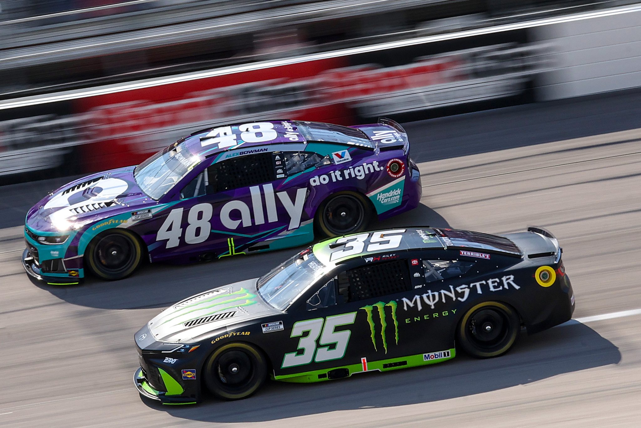 DARLINGTON, SOUTH CAROLINA - MARCH 21: Riley Herbst, driver of the #35 Monster Energy Toyota, and Justin Allgaier, driver of the #48 Ally Chevrolet, drive during practice for the NASCAR Cup Series Goodyear 400 at Darlington Raceway on March 21, 2026 in Darlington, South Carolina. (Photo by David Jensen/Getty Images) | Getty Images