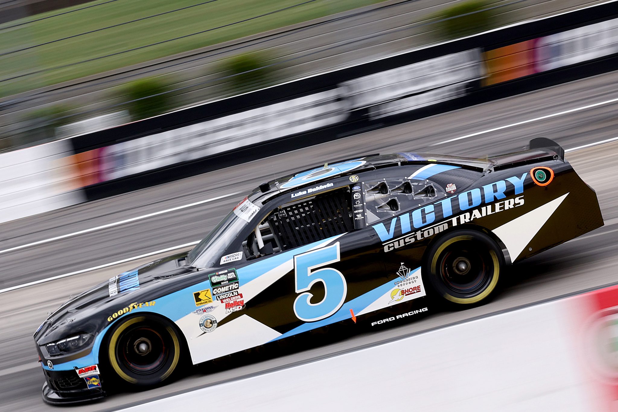 MARTINSVILLE, VIRGINIA - MARCH 27: Luke Baldwin, driver of the #5 Victory Custom Trailers Ford, drives during practice for the NASCAR O'Reilly Auto Parts Series NFPA 250 at Martinsville Speedway on March 27, 2026 in Martinsville, Virginia. (Photo by David Jensen/Getty Images) | Getty Images