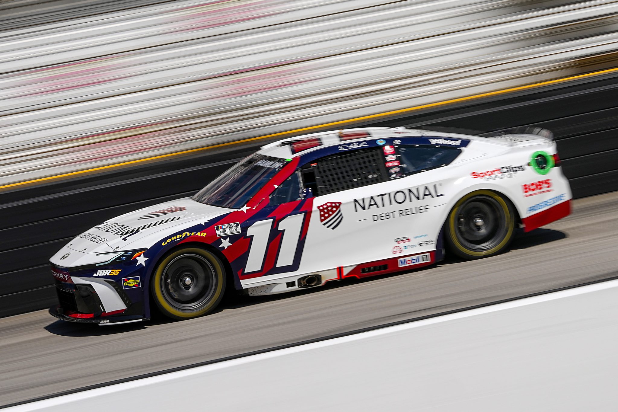 BRISTOL, TENNESSEE - APRIL 12: Denny Hamlin, driver of the #11 National Debt Relief Toyota, drives during the NASCAR Cup Series Food City 500 at Bristol Motor Speedway on April 12, 2026 in Bristol, Tennessee. (Photo by Matt Kelley/Getty Images) | Getty Images