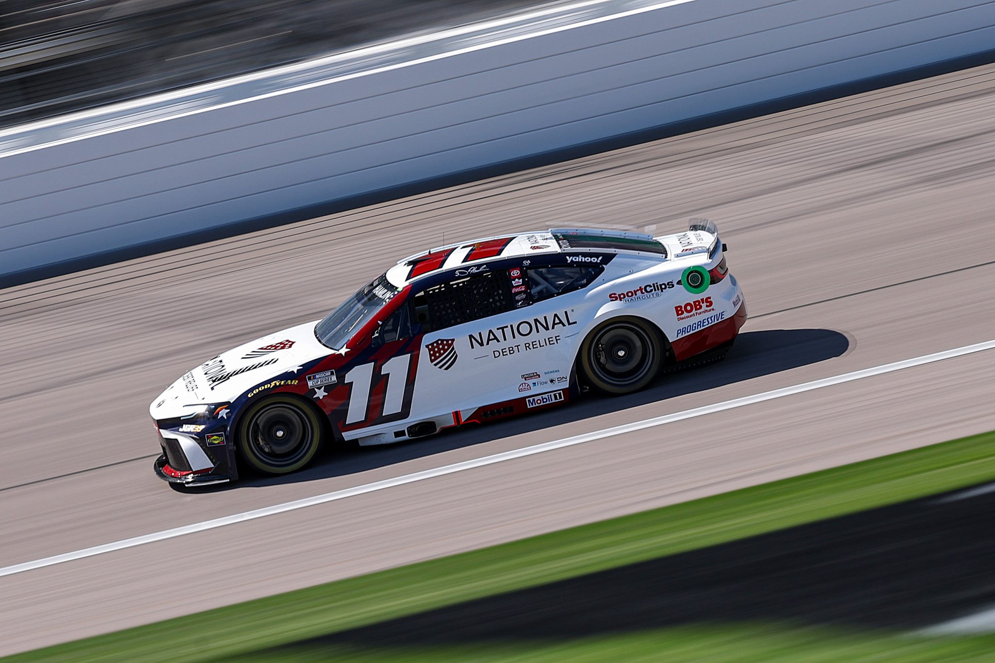 KANSAS CITY, KANSAS - APRIL 18: Denny Hamlin, driver of the #11 National Debt Relief Toyota, drives during practice for the NASCAR Cup Series AdventHealth 400 at Kansas Speedway on April 18, 2026 in Kansas City, Kansas. (Photo by David Jensen/Getty Images) | Getty Images