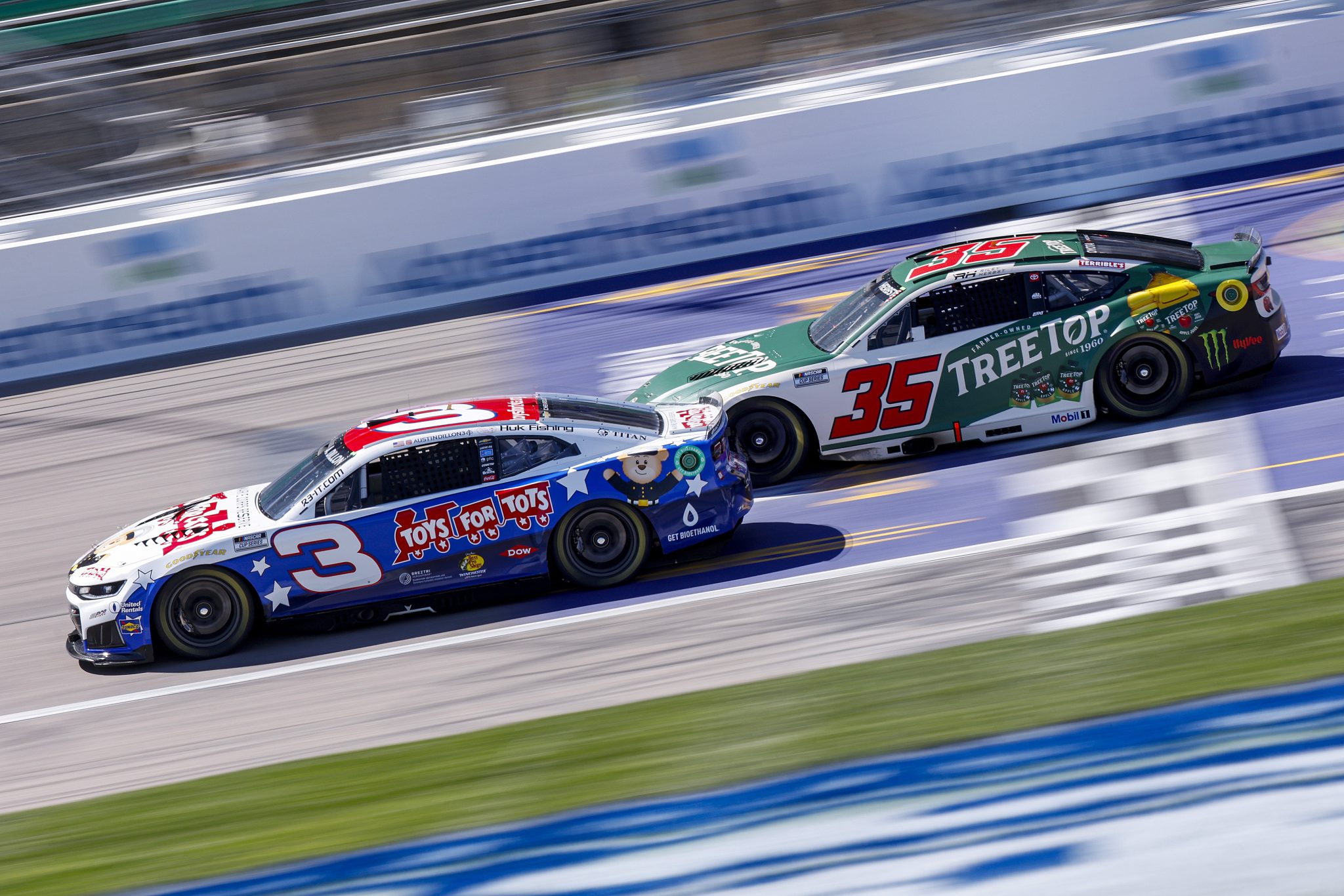 KANSAS CITY, KANSAS - APRIL 18: Austin Dillon, driver of the #3 Marine Corps Reserve Toys for Tots Chevrolet, and Riley Herbst, driver of the #35 TREETOP Toyota, drive during practice for the NASCAR Cup Series AdventHealth 400 at Kansas Speedway on April 18, 2026 in Kansas City, Kansas. (Photo by Sean Gardner/Getty Images) | Getty Images