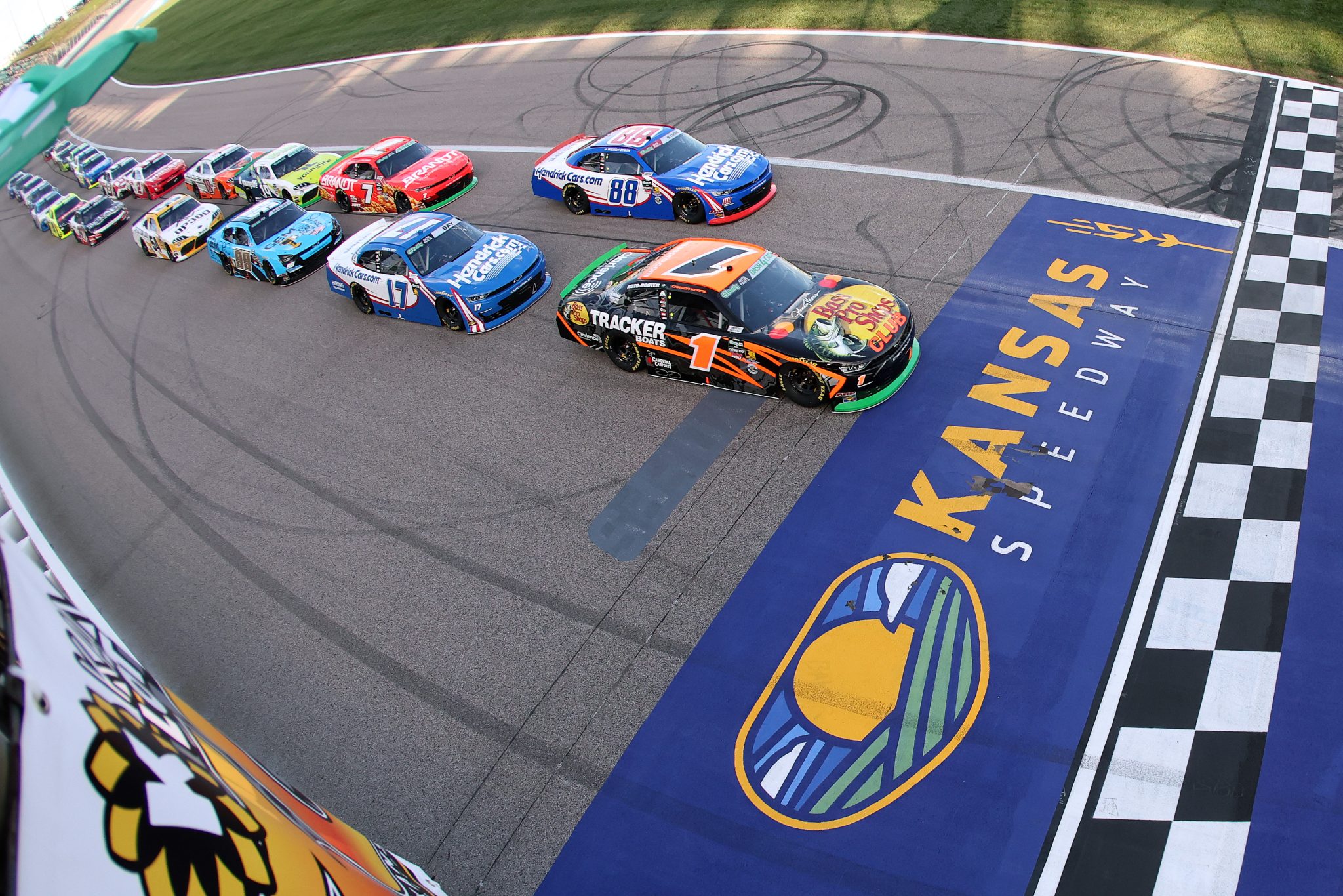 KANSAS CITY, KANSAS - APRIL 18: Carson Kvapil, driver of the #1 Bass Pro Shops Chevrolet, leads the field to the green flag to start the NASCAR O'Reilly Auto Parts Series Kansas Lottery 300 at Kansas Speedway on April 18, 2026 in Kansas City, Kansas. (Photo by David Jensen/Getty Images) | Getty Images