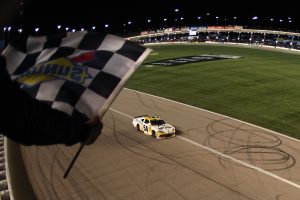 KANSAS CITY, KANSAS - APRIL 18: Taylor Gray, driver of the #54 Operation 300 Toyota, takes the checkered flag to win the NASCAR O'Reilly Auto Parts Series Kansas Lottery 300 at Kansas Speedway on April 18, 2026 in Kansas City, Kansas. (Photo by David Jensen/Getty Images) | Getty Images