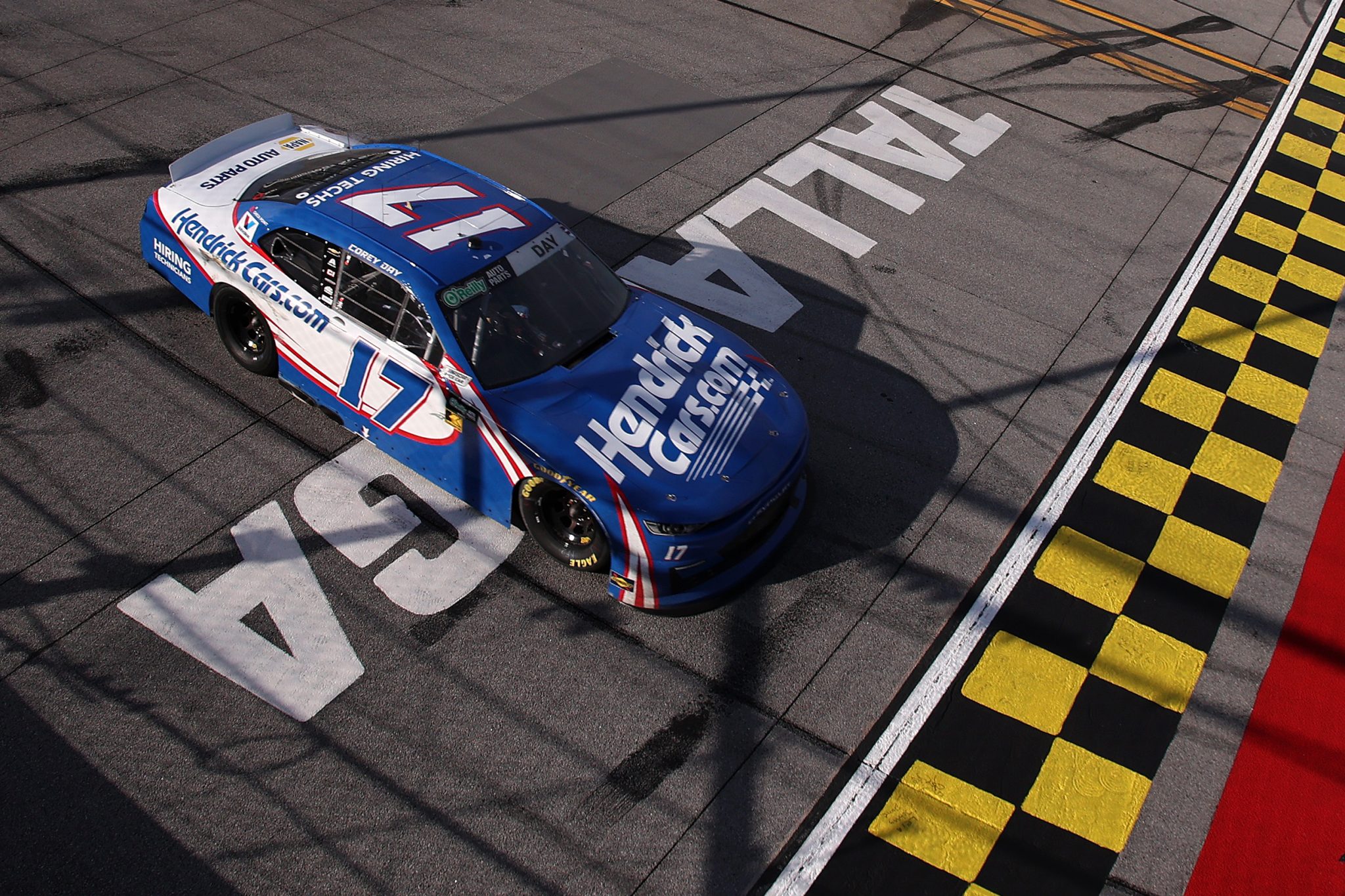 TALLADEGA, ALABAMA - APRIL 25: Corey Day, driver of the #17 HendrickCars.com Chevrolet, crosses the finish line to win the NASCAR O'Reilly Auto Parts Series Ag-Pro 300 at Talladega Superspeedway on April 25, 2026 in Talladega, Alabama. (Photo by David Jensen/Getty Images) | Getty Images