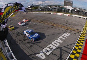 TALLADEGA, ALABAMA - APRIL 25: Corey Day, driver of the #17 HendrickCars.com Chevrolet, takes the checkered flag to win the NASCAR O'Reilly Auto Parts Series Ag-Pro 300 at Talladega Superspeedway on April 25, 2026 in Talladega, Alabama. (Photo by David Jensen/Getty Images) | Getty Images