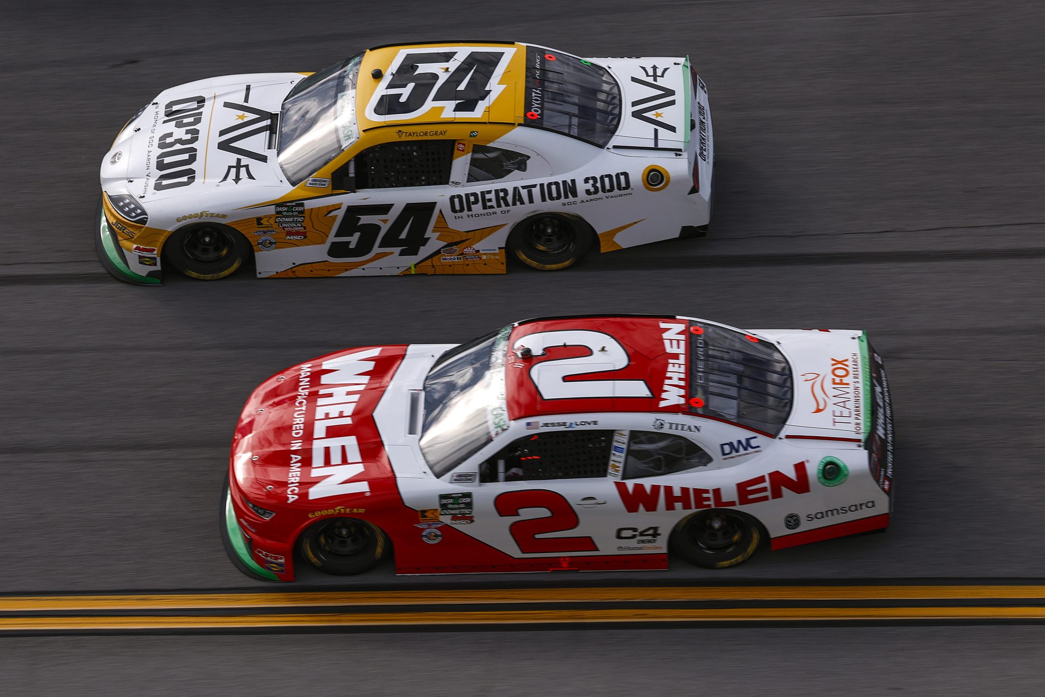 TALLADEGA, ALABAMA - APRIL 25: Taylor Gray, driver of the #54 Operation 300 Toyota, and Jesse Love, driver of the #2 Whelen Chevrolet, race during the NASCAR O'Reilly Auto Parts Series Ag-Pro 300 at Talladega Superspeedway on April 25, 2026 in Talladega, Alabama. (Photo by Sean Gardner/Getty Images) | Getty Images