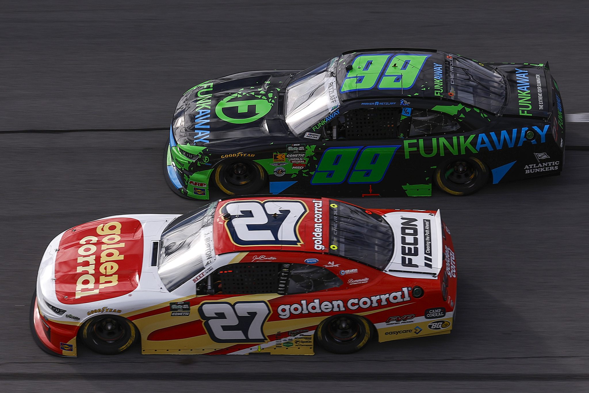 TALLADEGA, ALABAMA - APRIL 25: Parker Retzlaff, driver of the #99 FUNKAWAY Chevrolet, and Jeb Burton, driver of the #27 Golden Corral Chevrolet, race during the NASCAR O'Reilly Auto Parts Series Ag-Pro 300 at Talladega Superspeedway on April 25, 2026 in Talladega, Alabama. (Photo by Sean Gardner/Getty Images) | Getty Images
