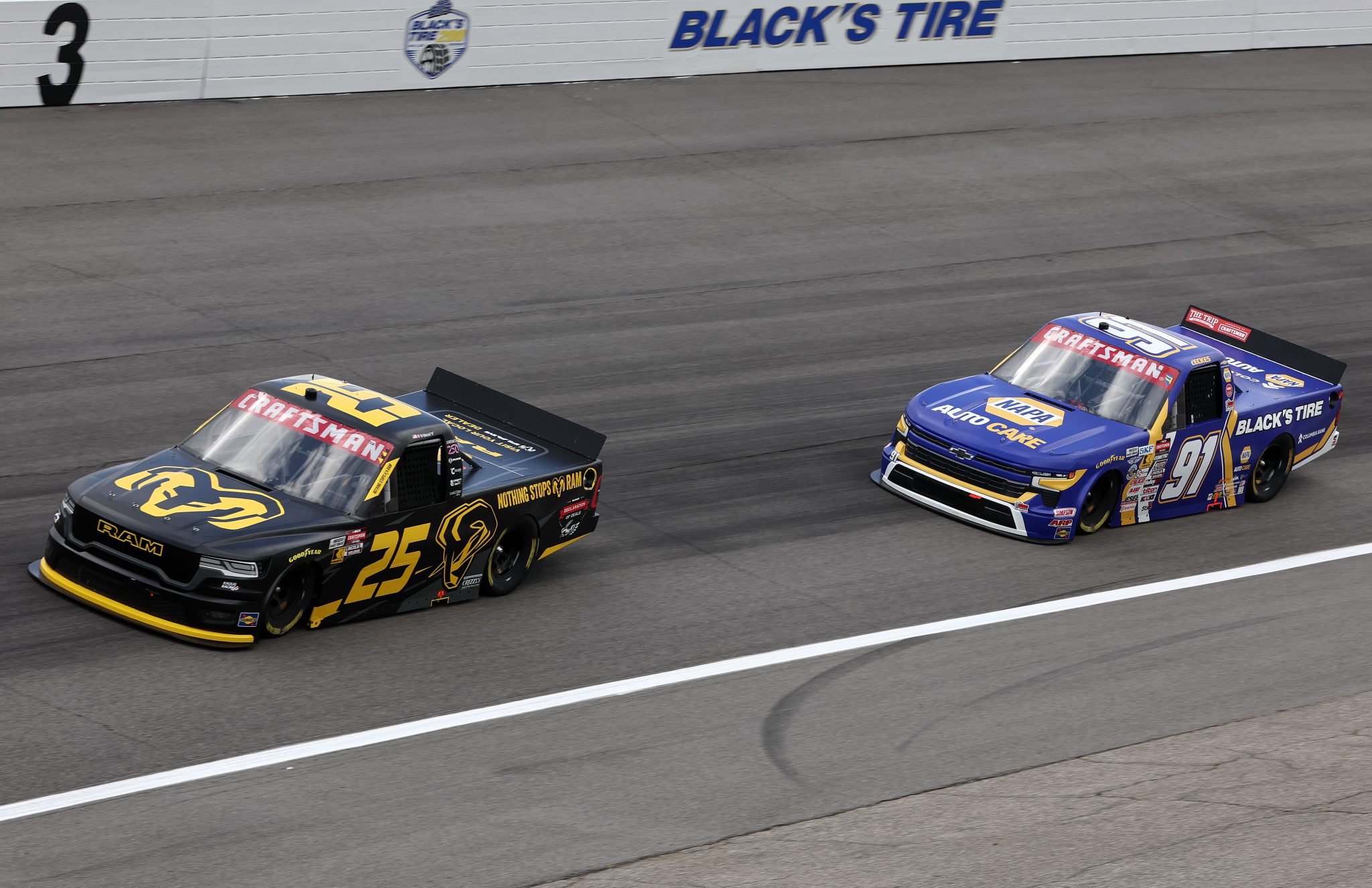 ROCKINGHAM, NORTH CAROLINA - APRIL 03: Ty Dillon, driver of the #25 Nothing Stops Ram RAM, and Christian Eckes, driver of the #91 NAPA Auto Care/Black's Tire Chevrolet, qualify for the NASCAR Craftsman Truck Series Black's Tire 200 at Rockingham Speedway on April 03, 2026 in Rockingham, North Carolina. (Photo by James Gilbert/Getty Images) | Getty Images