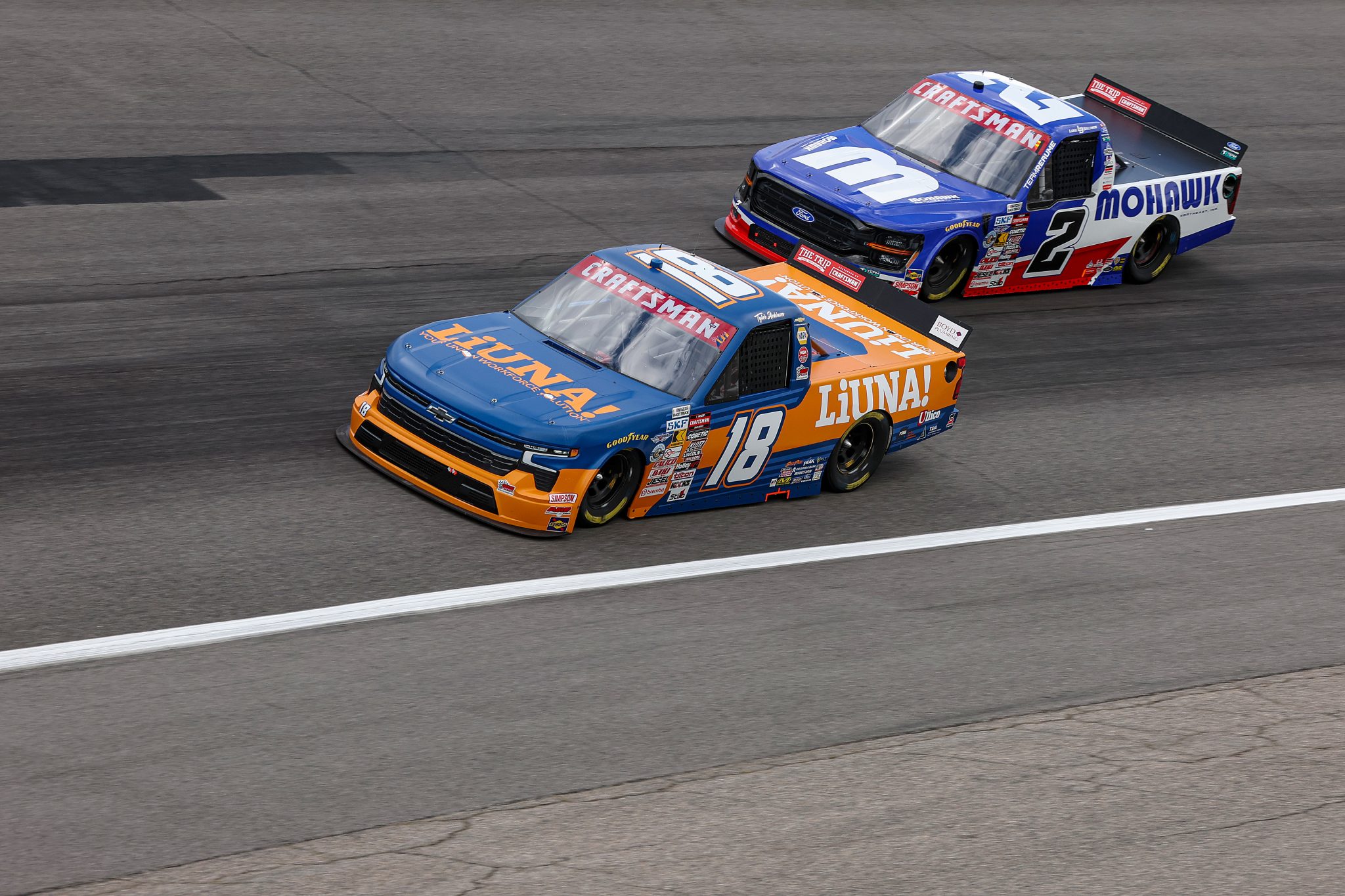 ROCKINGHAM, NORTH CAROLINA - APRIL 03: Tyler Ankrum, driver of the #18 LiUNA! Chevrolet, and Luke Baldwin, driver of the #2 Mohawk Northeast Inc Ford, qualify for the NASCAR Craftsman Truck Series Black's Tire 200 at Rockingham Speedway on April 03, 2026 in Rockingham, North Carolina. (Photo by James Gilbert/Getty Images) | Getty Images