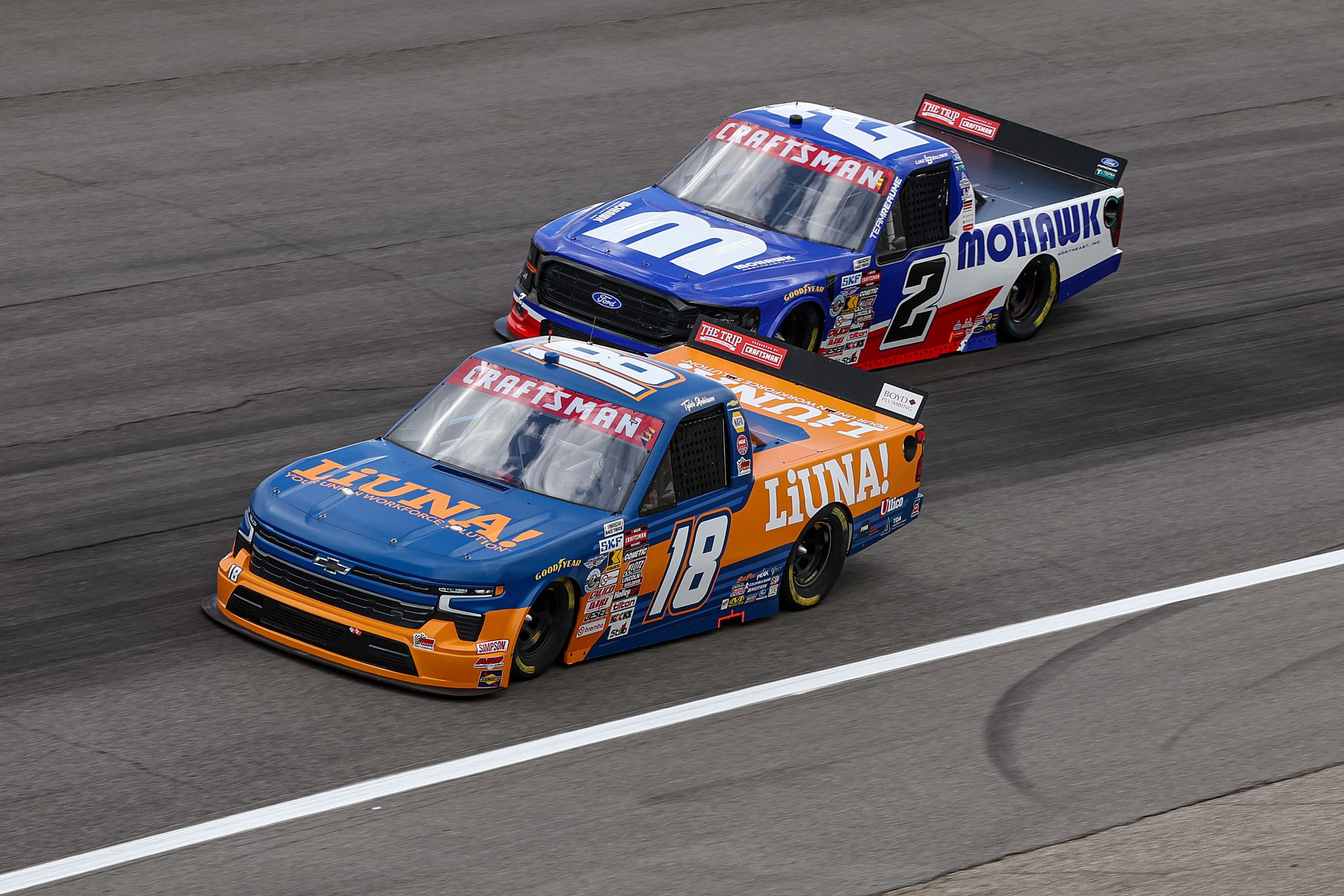 ROCKINGHAM, NORTH CAROLINA - APRIL 03: Tyler Ankrum, driver of the #18 LiUNA! Chevrolet, and Luke Baldwin, driver of the #2 Mohawk Northeast Inc Ford, qualify for the NASCAR Craftsman Truck Series Black's Tire 200 at Rockingham Speedway on April 03, 2026 in Rockingham, North Carolina. (Photo by James Gilbert/Getty Images) | Getty Images