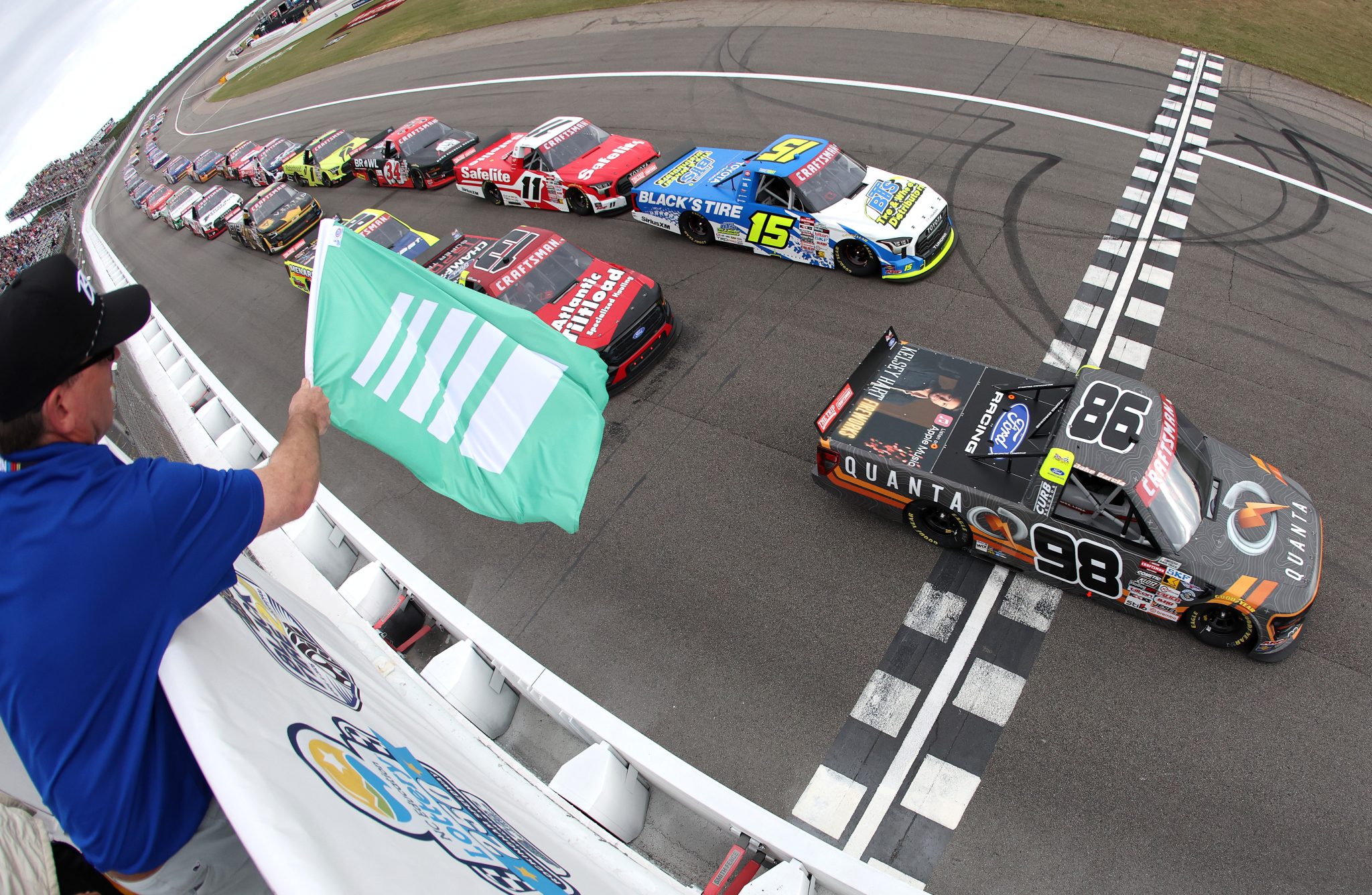 ROCKINGHAM, NORTH CAROLINA - APRIL 03: Jake Garcia, driver of the #98 Quanta Services/Curb Records Ford, leads the field to the green flag to start the NASCAR Craftsman Truck Series Black's Tire 200 at Rockingham Speedway on April 03, 2026 in Rockingham, North Carolina. (Photo by Meg Oliphant/Getty Images) | Getty Images
