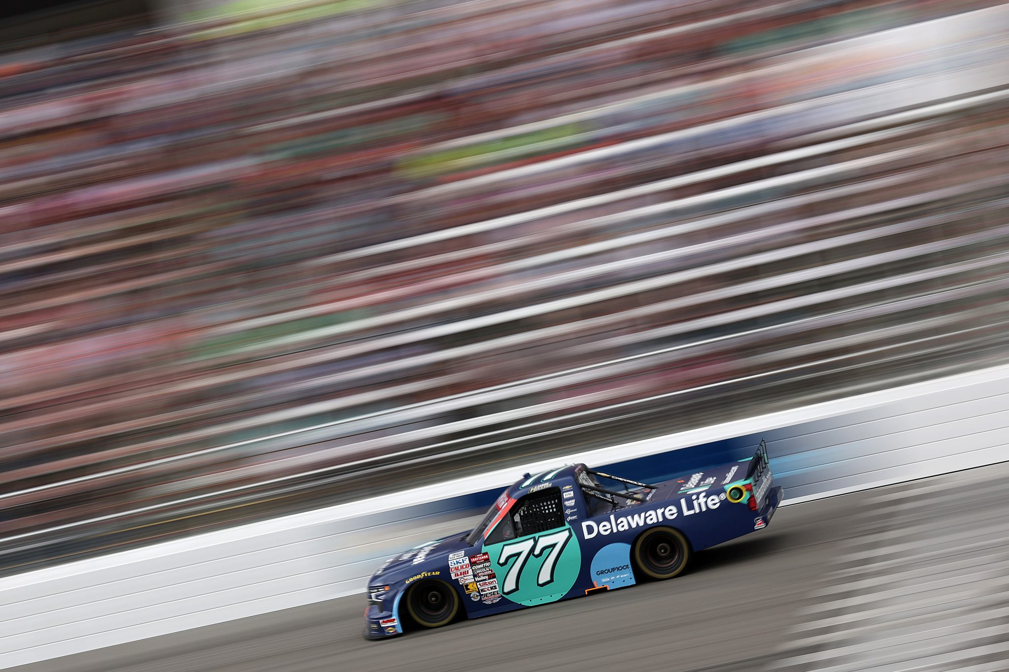 ROCKINGHAM, NORTH CAROLINA - APRIL 03: Carson Hocevar, driver of the #77 Delaware Life Chevrolet, drives during the NASCAR Craftsman Truck Series Black's Tire 200 at Rockingham Speedway on April 03, 2026 in Rockingham, North Carolina. (Photo by James Gilbert/Getty Images) | Getty Images