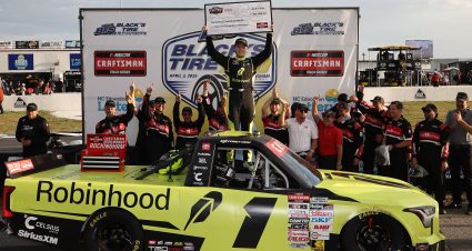 ROCKINGHAM, NORTH CAROLINA - APRIL 03: Corey Heim, driver of the #1 Robinhood Toyota, celebrates with the Triple Truck Challenge $100,000.00 check in victory lane after winning the the NASCAR Craftsman Truck Series Black's Tire 200 at Rockingham Speedway on April 03, 2026 in Rockingham, North Carolina. (Photo by James Gilbert/Getty Images) | Getty Images
