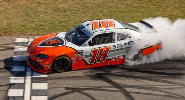 ROCKINGHAM, NORTH CAROLINA - APRIL 04: William Sawalich, driver of the #18 Soundgear Toyota, celebrates with a burnout after winning the NASCAR O'Reilly Auto Parts Series North Carolina Education Lottery 250 Presented by Black's Tire at Rockingham Speedway on April 04, 2026 in Rockingham, North Carolina. (Photo by James Gilbert/Getty Images) | Getty Images