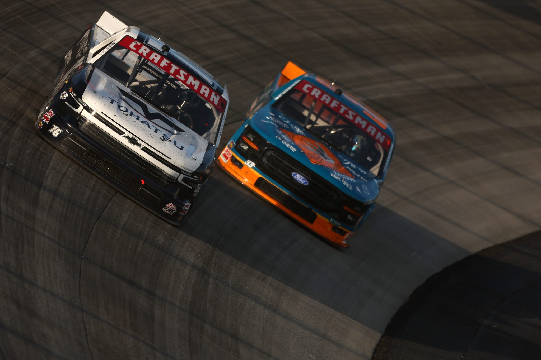 DOVER, DELAWARE - MAY 15: Spencer Boyd, driver of the #76 Tohatsu Chevrolet, and Frankie Muniz, driver of the #33 Nico's Bagels & Brunch Ford, race during the NASCAR Craftsman Truck Series ECOSAVE 200 at Dover Motor Speedway on May 15, 2026 in Dover, Delaware. (Photo by Meg Oliphant/Getty Images) | Getty Images