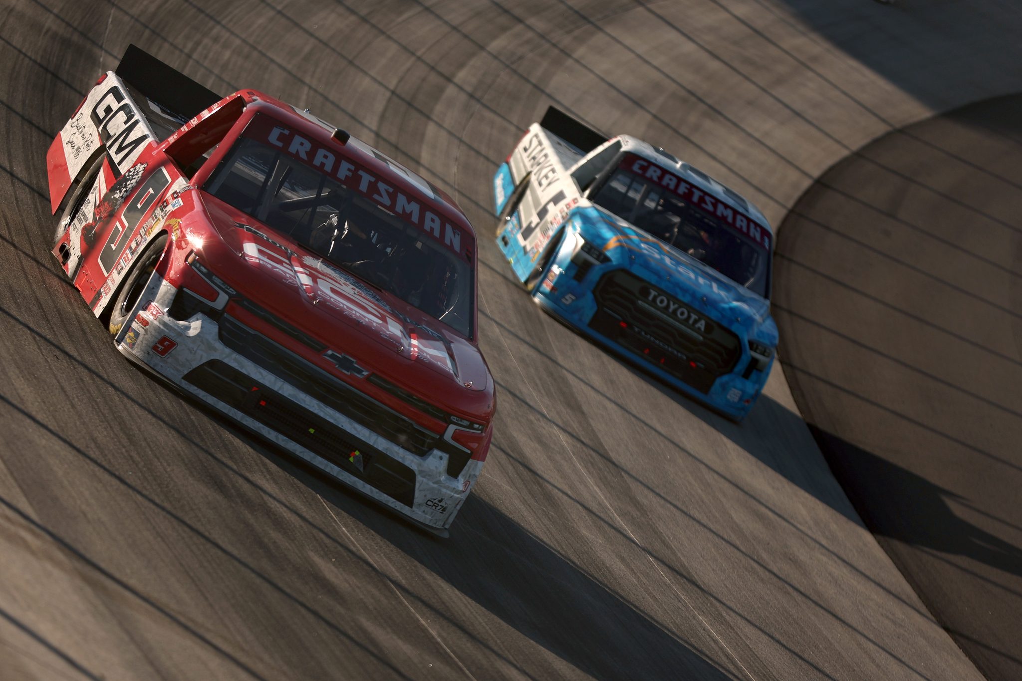 DOVER, DELAWARE - MAY 15: Grant Enfinger, driver of the #9 Grant County Mulch Chevrolet, and William Sawalich, driver of the #5 Starkey Toyota, race during the NASCAR Craftsman Truck Series ECOSAVE 200 at Dover Motor Speedway on May 15, 2026 in Dover, Delaware. (Photo by Meg Oliphant/Getty Images) | Getty Images