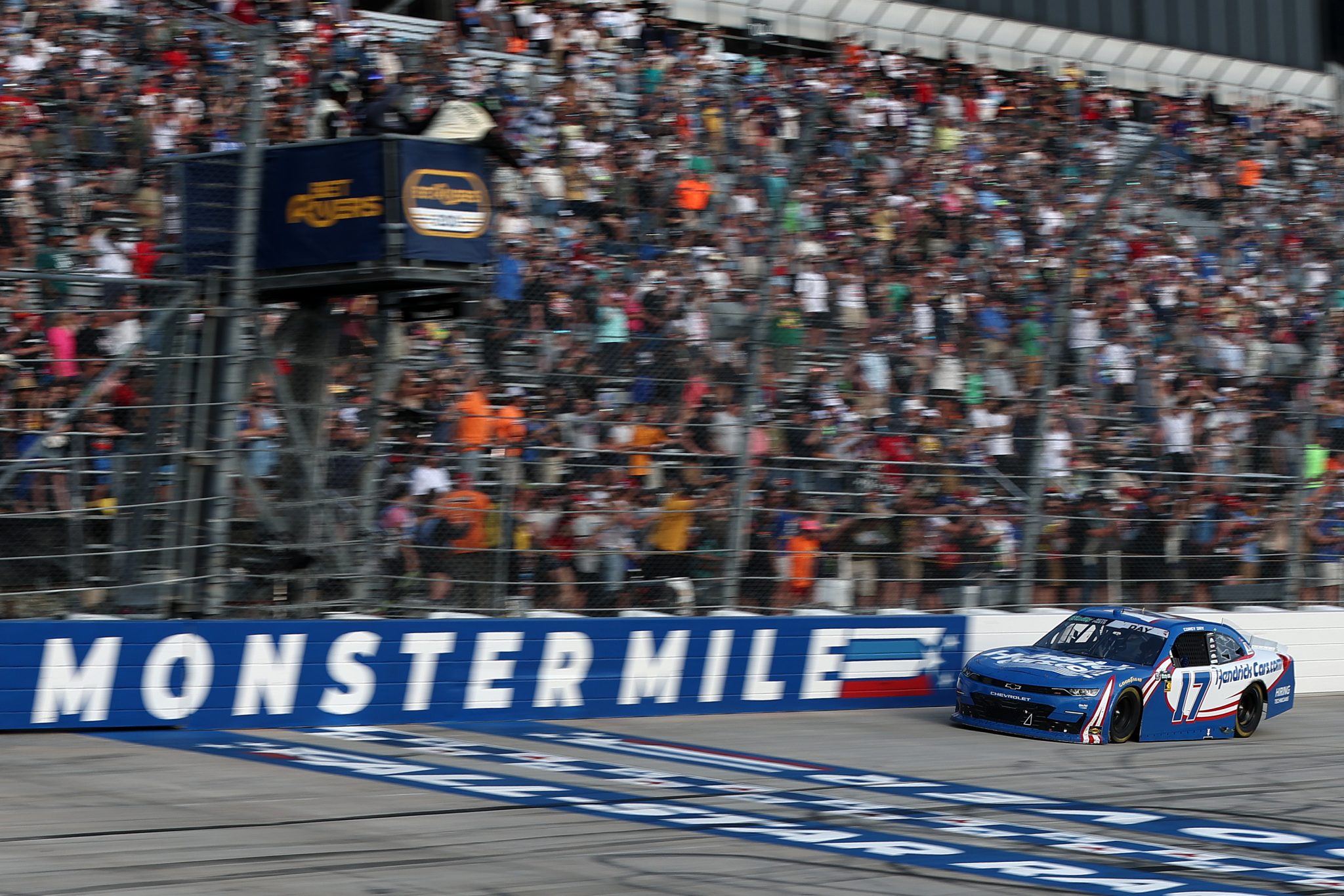 DOVER, DELAWARE - MAY 16: Corey Day, driver of the #17 HendrickCars.com Chevrolet, crosses the finish line to win the NASCAR O'Reilly Auto Parts Series BetRivers 200 at Dover Motor Speedway on May 16, 2026 in Dover, Delaware. (Photo by Meg Oliphant/Getty Images) | Getty Images