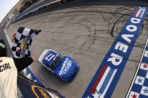 DOVER, DELAWARE - MAY 16: Corey Day, driver of the #17 HendrickCars.com Chevrolet, takes the checkered flag to win the NASCAR O'Reilly Auto Parts Series BetRivers 200 at Dover Motor Speedway on May 16, 2026 in Dover, Delaware. (Photo by Sean Gardner/Getty Images) | Getty Images