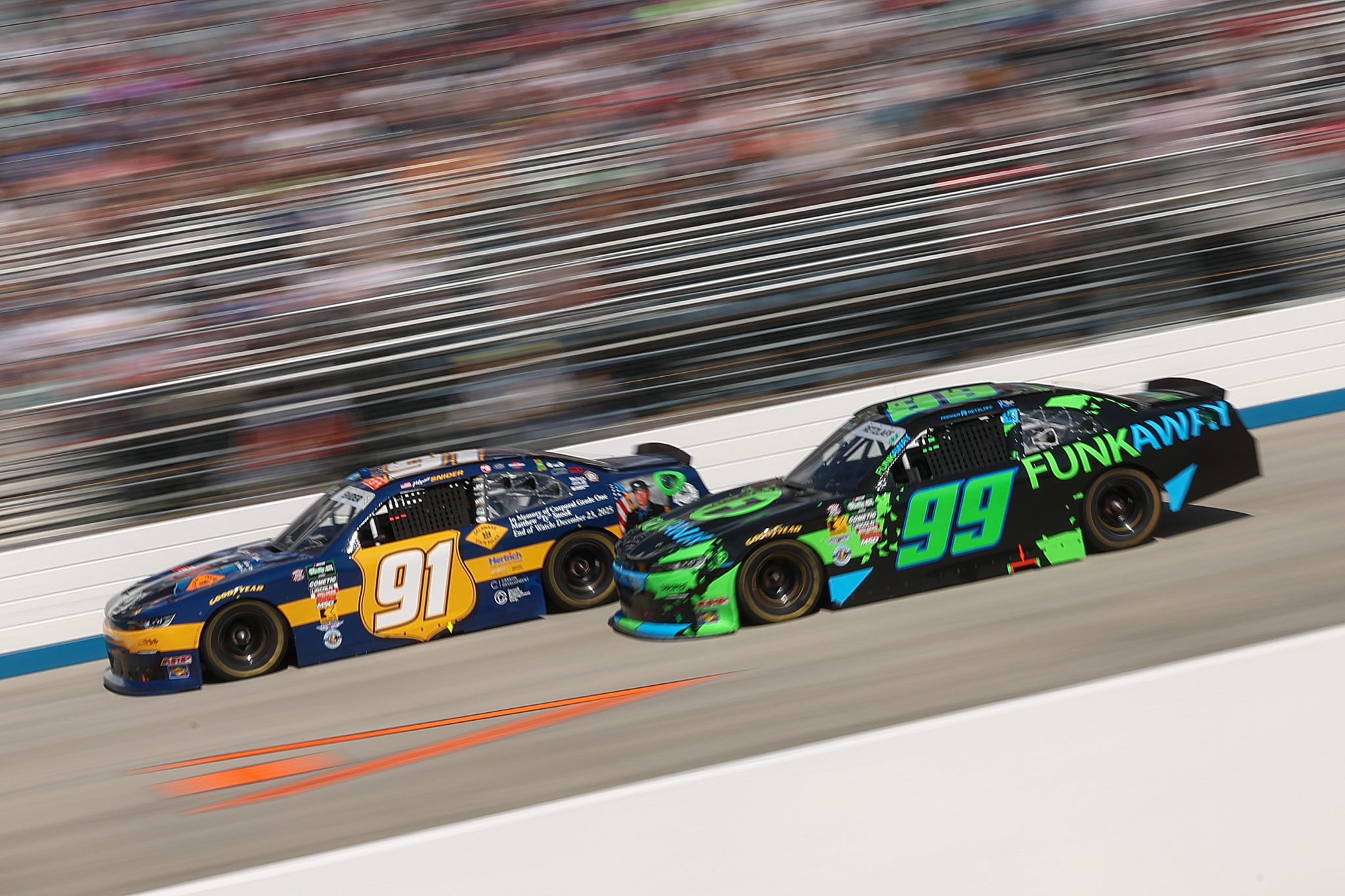DOVER, DELAWARE - MAY 16: Parker Retzlaff, driver of the #99 FUNKAWAY Chevrolet, and Myatt Snider, driver of the #91 Del. St. Police Honoring Ty Snook Chevrolet, race during the NASCAR O'Reilly Auto Parts Series BetRivers 200 at Dover Motor Speedway on May 16, 2026 in Dover, Delaware. (Photo by Meg Oliphant/Getty Images) | Getty Images