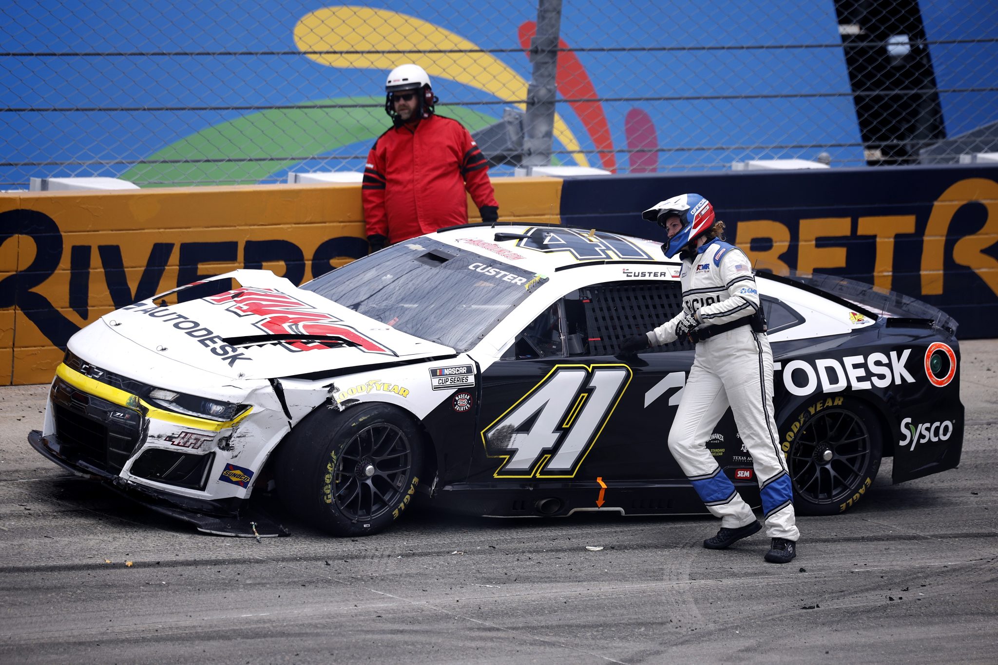 DOVER, DELAWARE - MAY 17: Cole Custer, driver of the #41 Haas/Autodesk Chevrolet, is assisted by the American Medical Response (AMR) safety team after an on-track incident to start the NASCAR Cup Series All-Star Race at Dover Motor Speedway on May 17, 2026 in Dover, Delaware. (Photo by Sean Gardner/Getty Images) | Getty Images