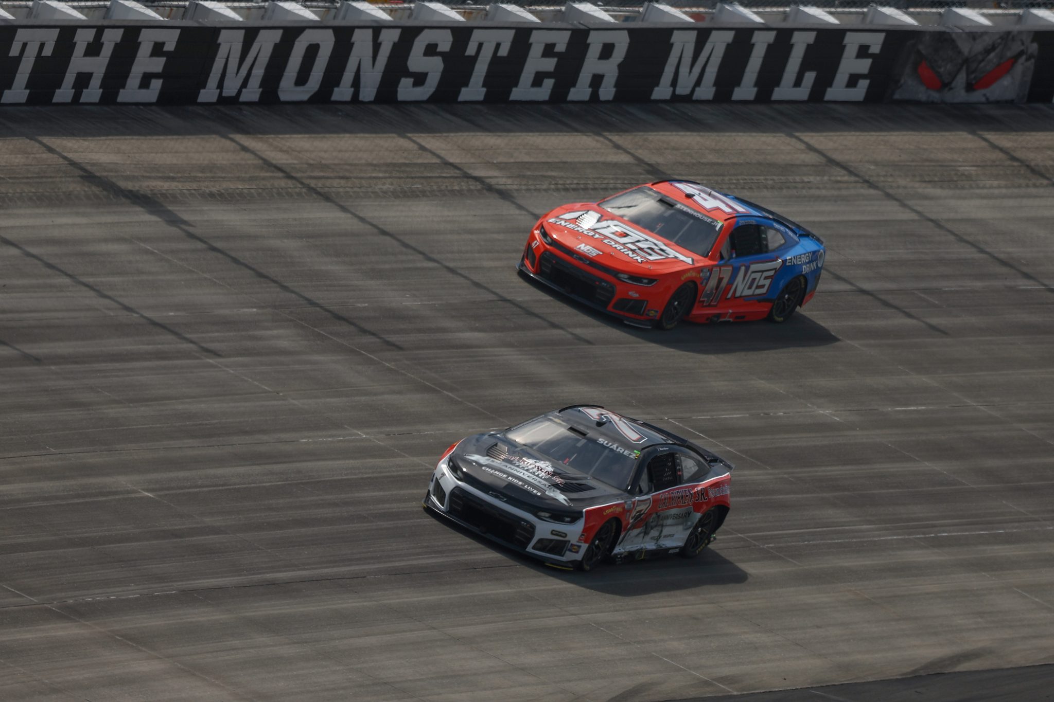 DOVER, DELAWARE - MAY 17: Daniel Suarez, driver of the #7 Cal Ripken Sr. Foundation Chevrolet, and Ricky Stenhouse Jr., driver of the #47 NOS Energy Chevrolet, race during the NASCAR Cup Series All-Star Race at Dover Motor Speedway on May 17, 2026 in Dover, Delaware. (Photo by Meg Oliphant/Getty Images) | Getty Images