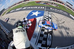 FORT WORTH, TEXAS - MAY 02: Kyle Larson, driver of the #88 HendrickCars.com Chevrolet, takes the checkered flag to win the NASCAR O'Reilly Auto Parts Series Andy's Frozen Custard 340 at Texas Motor Speedway on May 02, 2026 in Fort Worth, Texas. (Photo by Logan Riely/Getty Images) | Getty Images