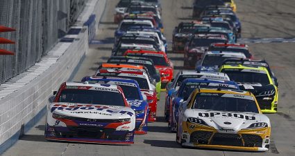 DOVER, DELAWARE - MAY 16: Ross Chastain, driver of the #9 Roto-Rooter Chevrolet, and Taylor Gray, driver of the #54 Operation 300 Toyota, lead the field during the NASCAR O'Reilly Auto Parts Series BetRivers 200 at Dover Motor Speedway on May 16, 2026 in Dover, Delaware. (Photo by Sean Gardner/Getty Images) | Getty Images